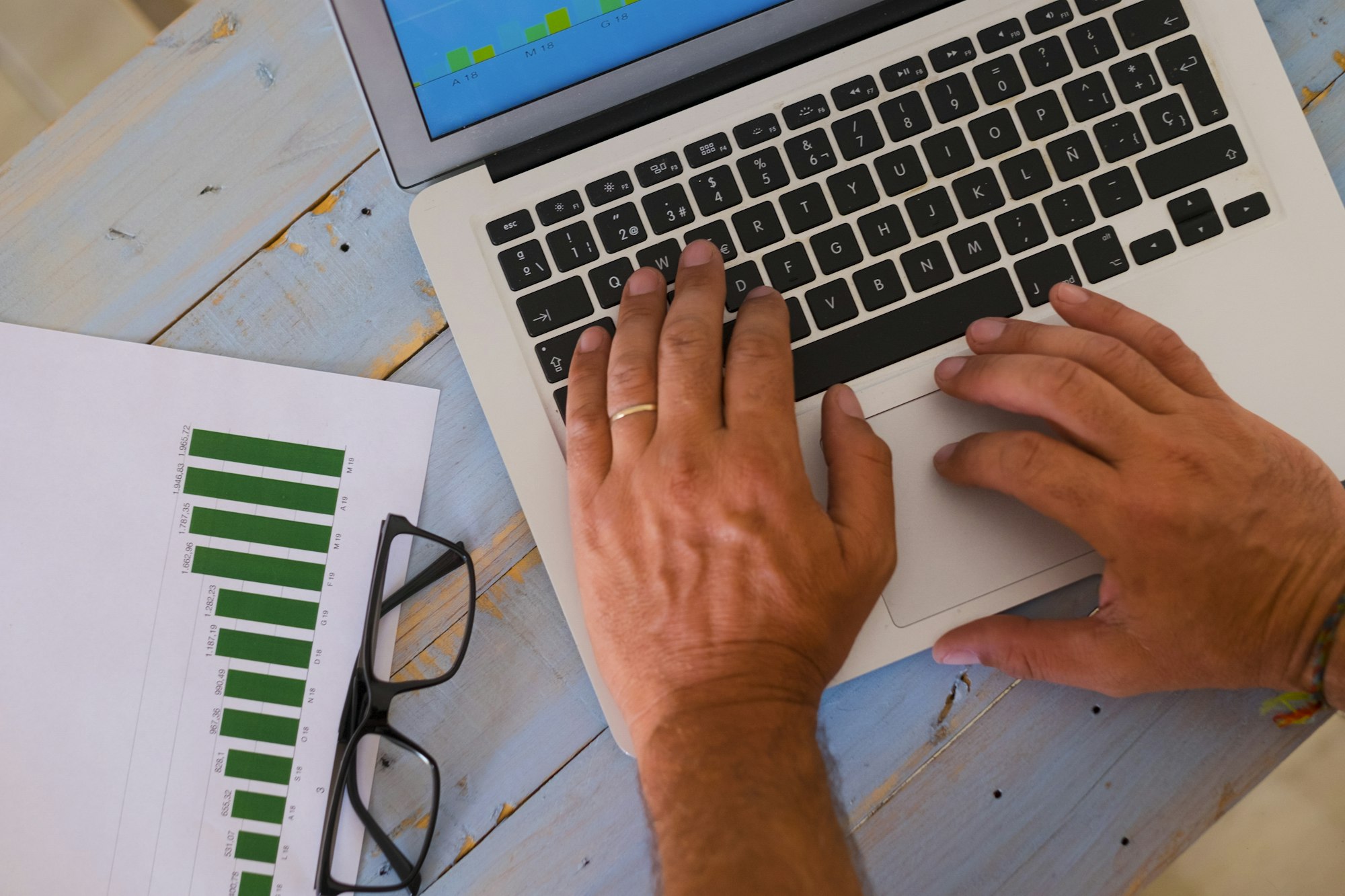 close up of hands of man on a laptop working hard to create an agency - business man